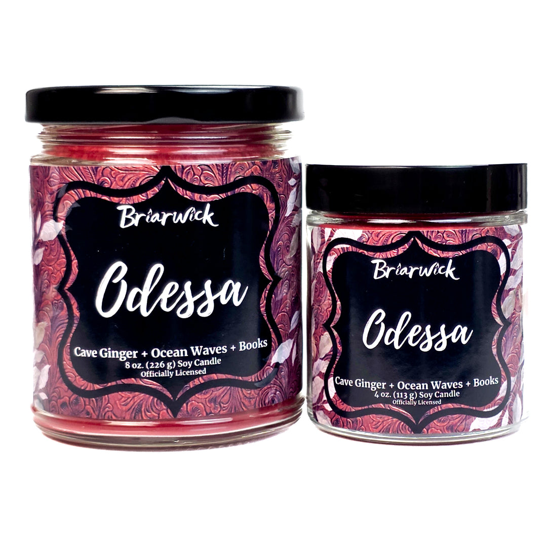 Two Briarwick Odessa candles with red decorative labels on a white background
