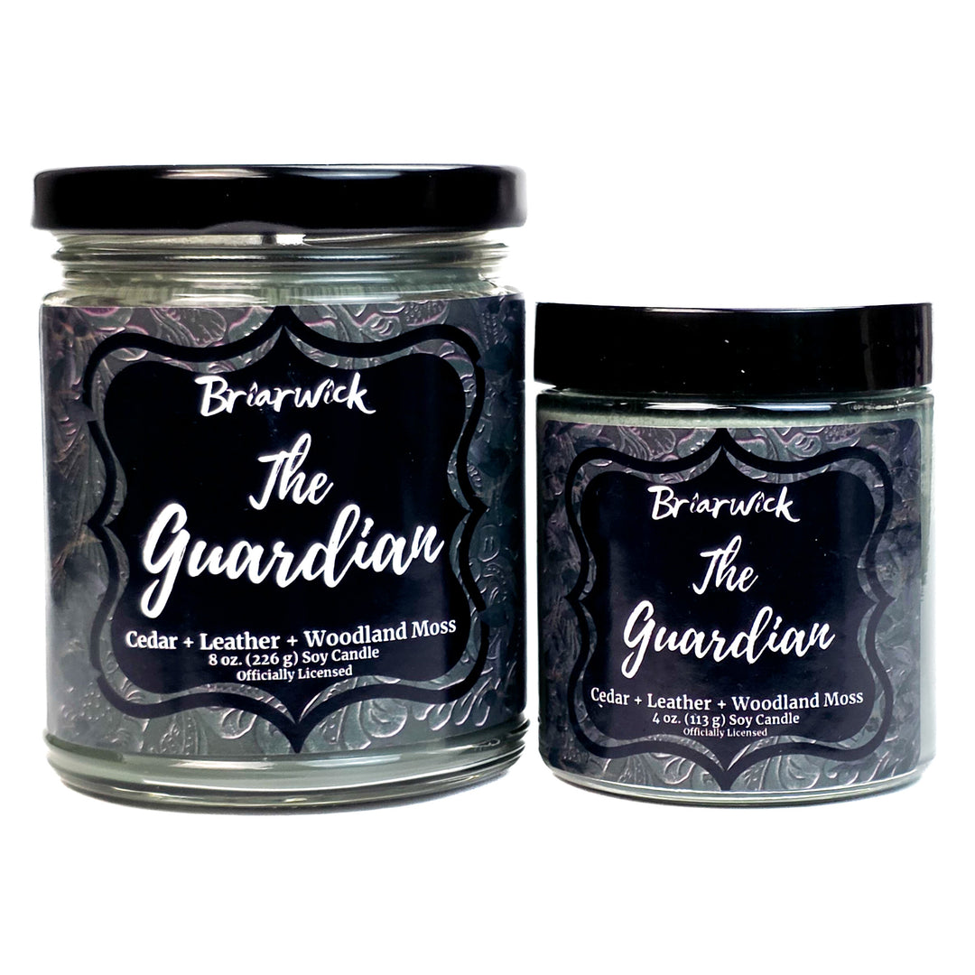 Two jars of Briarwick 'The Guardian' candle with green labels on a white background
