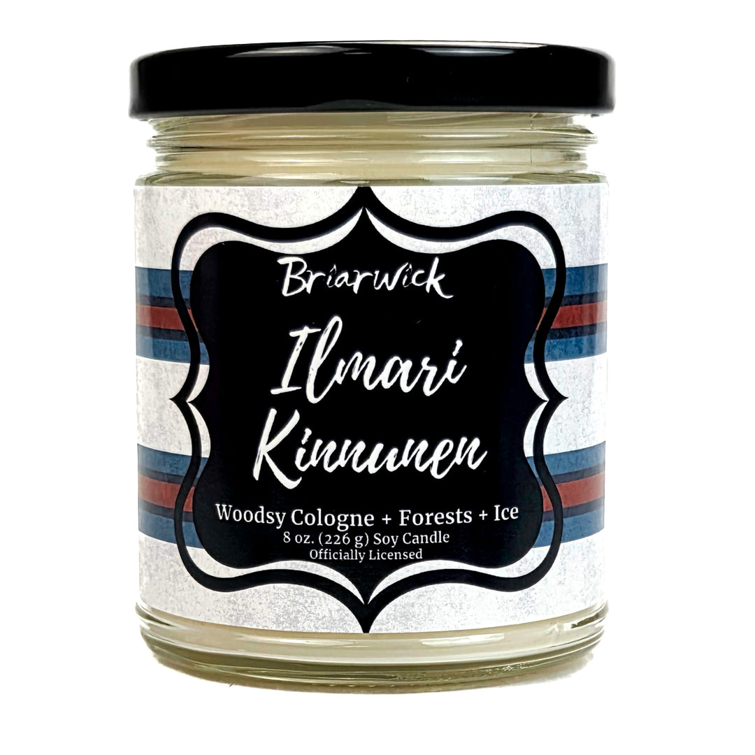 Jar of Briarwick Ilmari Kinnunen candle with a striped label on a white background