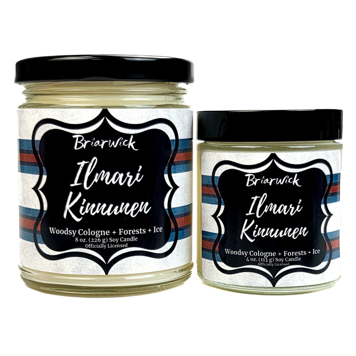 Two jars of Briarwick Ilmari Kinnunen candles with striped labels on a white background