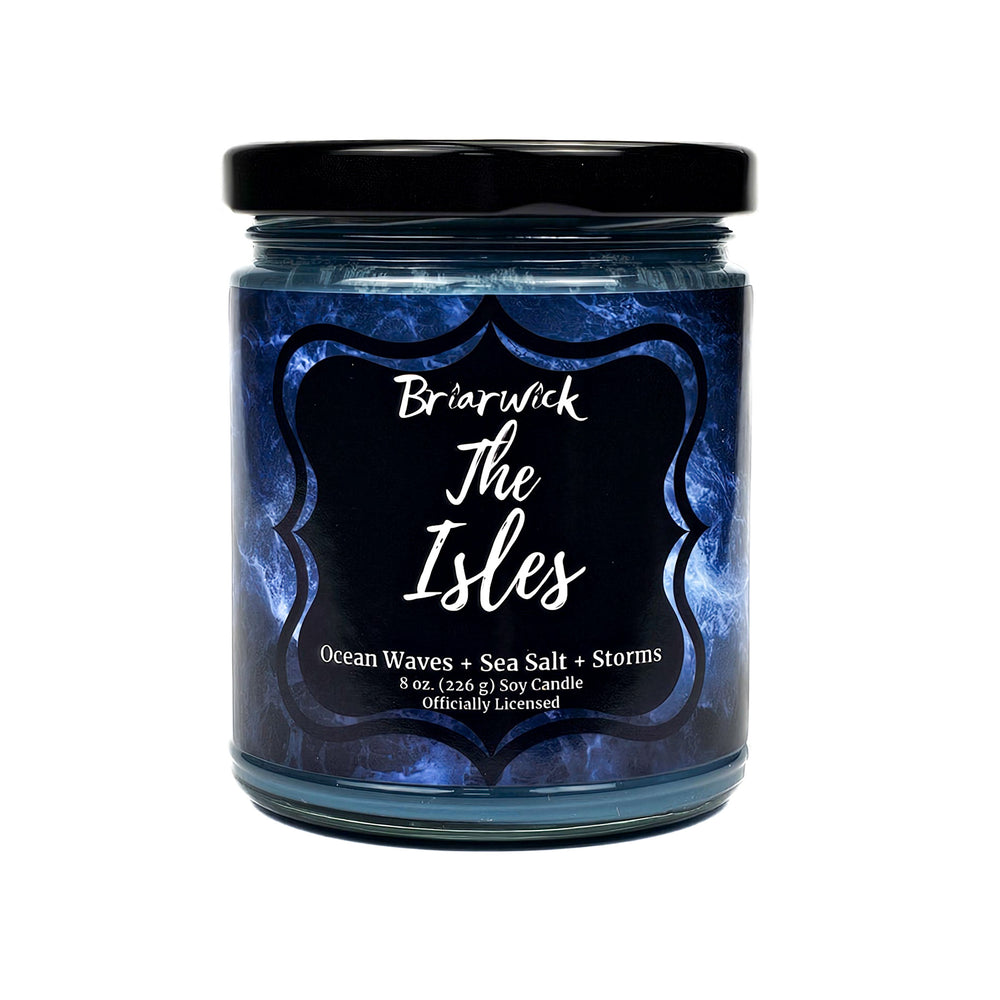 The Isles 8oz blue candle with blue smoke design on a white background