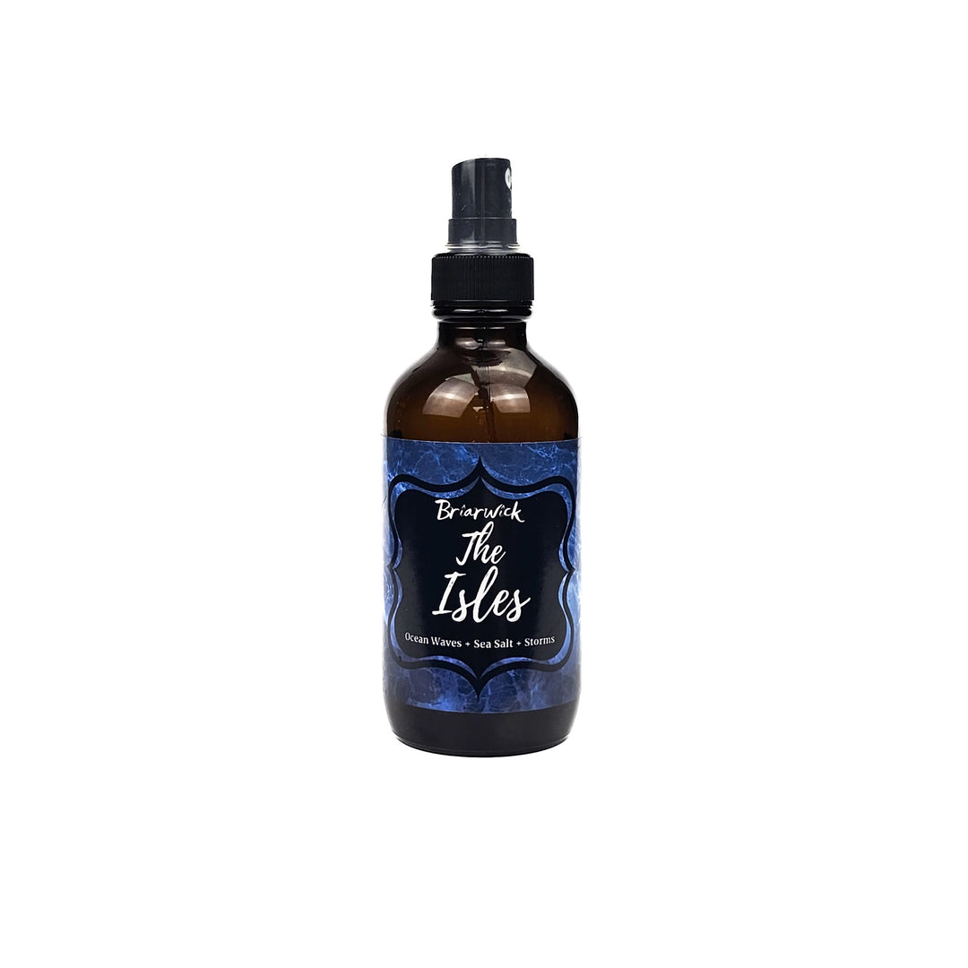The Isles 4oz Linen Spray with blue smoke design on a white background