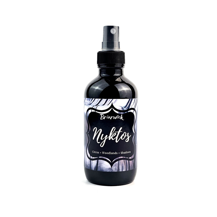 Nyktos 4oz Linen Spray with black & white textured design on a white background
