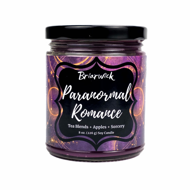 An 8 oz soy candle in a clear glass jar with a black lid, featuring a purple label with orange swirls and a black label that reads 'Briarwick Paranormal Romance'.