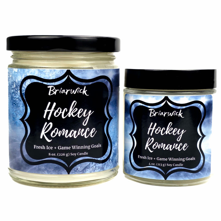 Two jars of Briarwick 'Hockey Romance' soy candles on a white background, one 8 oz and one 4 oz, both with black lids and blue ice-patterned labels.