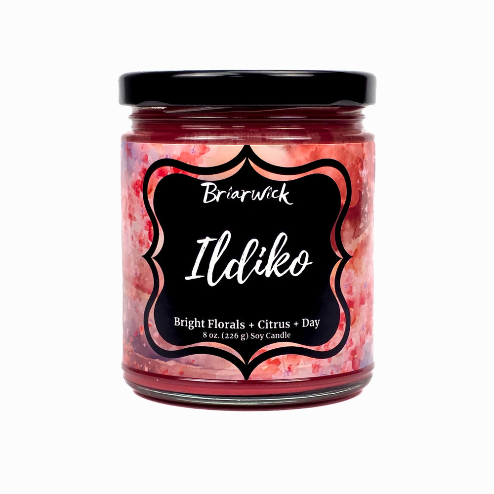 Ildiko 8oz brick red candle with red textural design on a white background