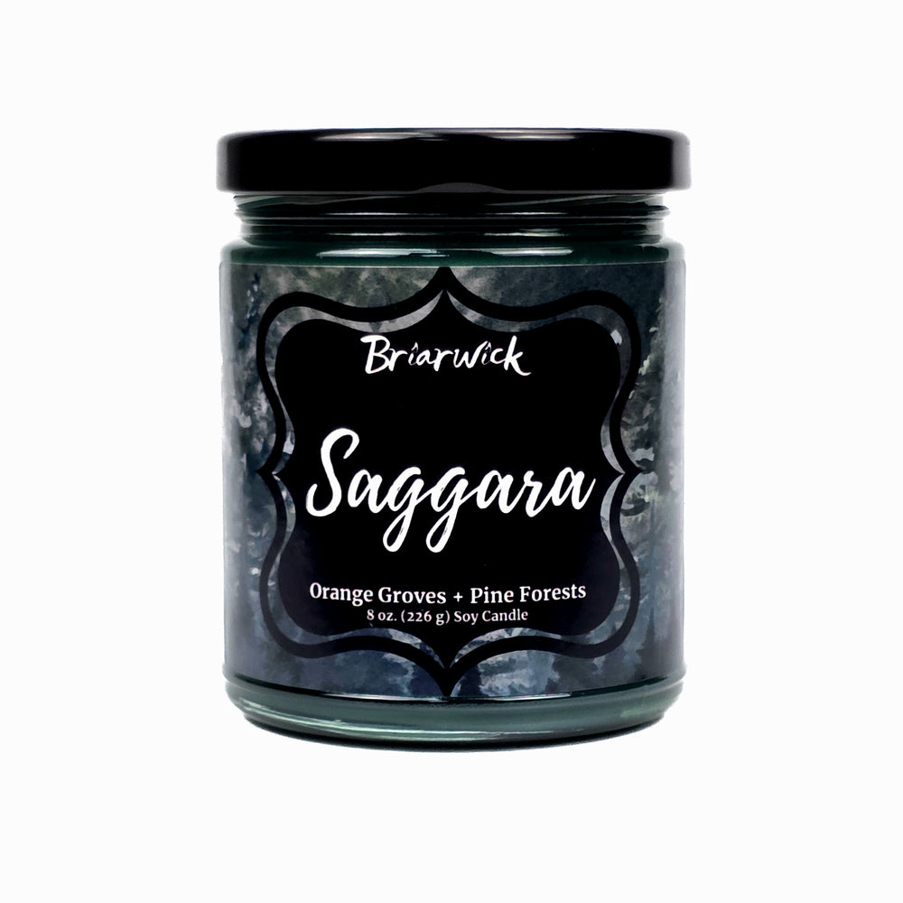 Saggara 8oz dark green candle with green textural design on a white background