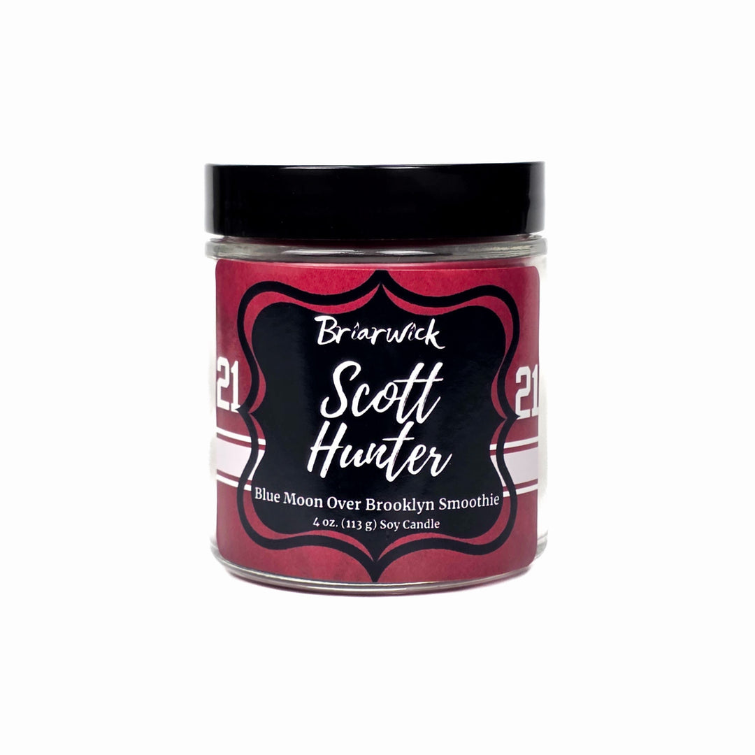 Scott Hunter Candle jar with a black lid and red label on a white background