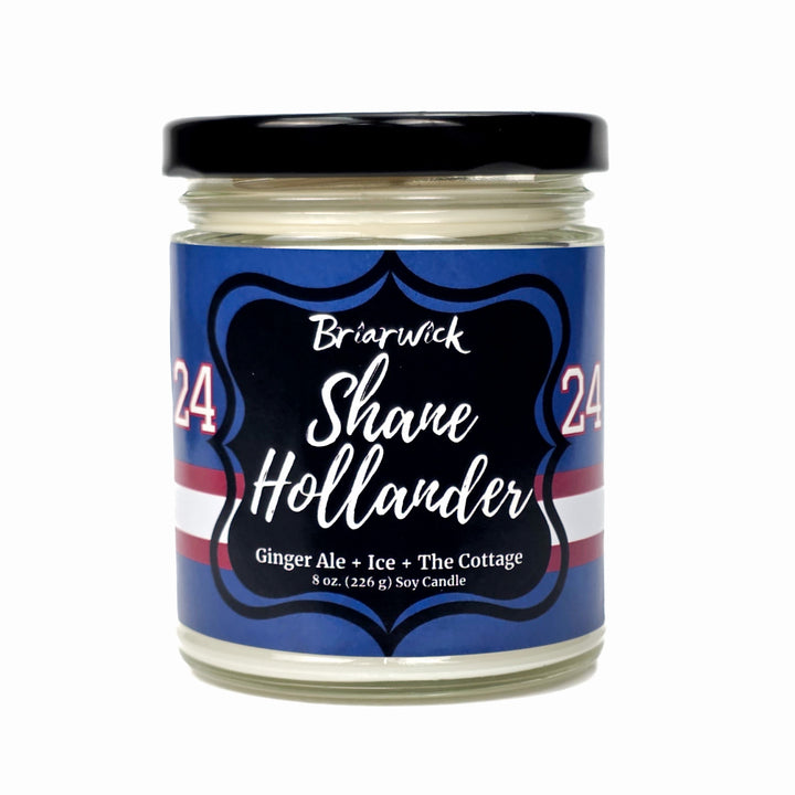 Jar candle with a label featuring 'Briarwick 24' and 'Shane Hollander' on a white background
