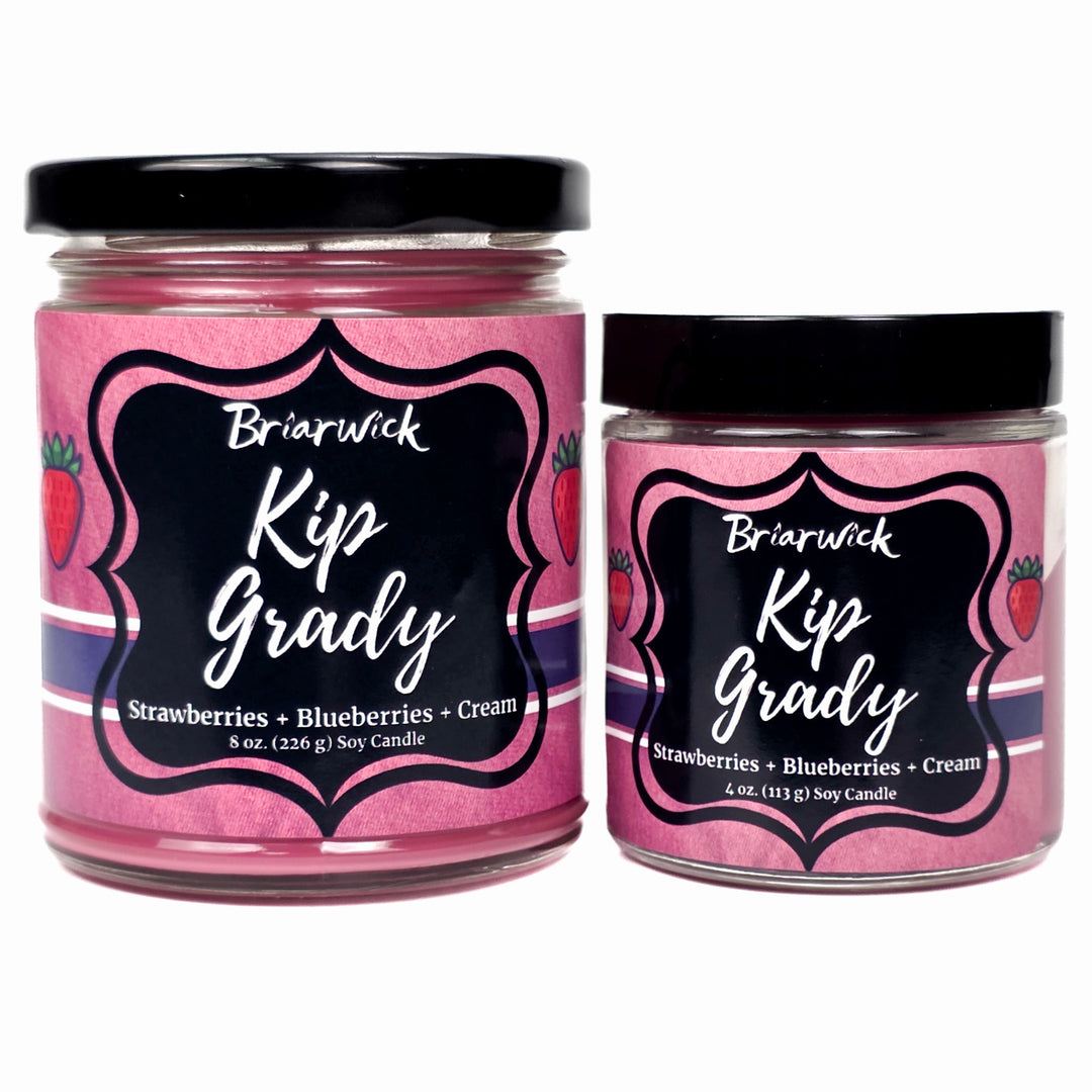 Two jars of Briarwick Kip Grady candles with pink labels on a white background