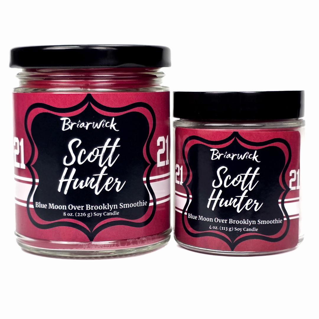 Two jars of Briarwick Scott Hunter candles with red labels on a white background