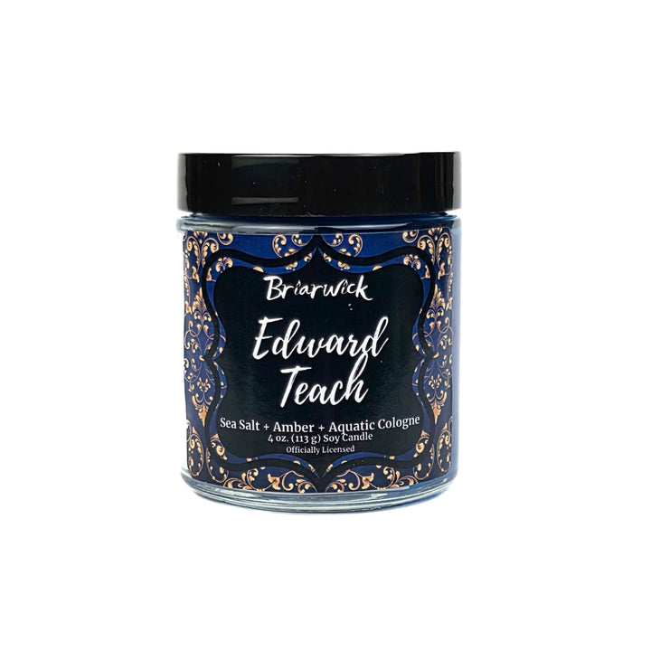 Candle jar with decorative label on a white background