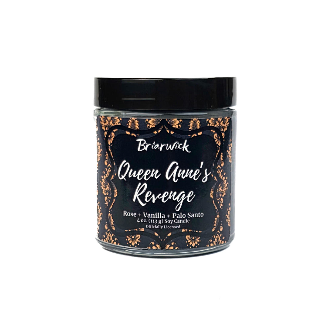 Candle jar labeled 'Queen Anne's Revenge' with decorative text on a white background