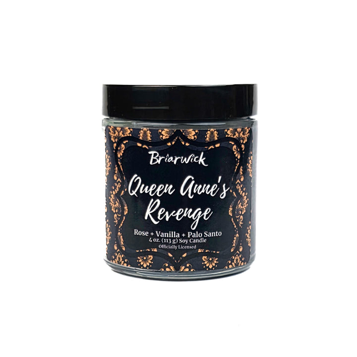 Candle jar labeled 'Queen Anne's Revenge' with decorative text on a white background