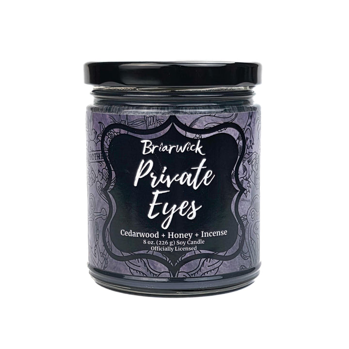 Candle jar labeled 'Private Eyes' by Briarwick on a white background