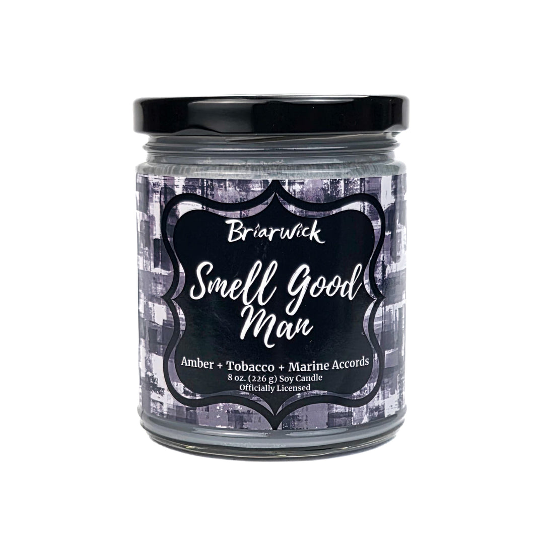 Candle jar labeled 'Smell Good Man' by Briarwick on a white background