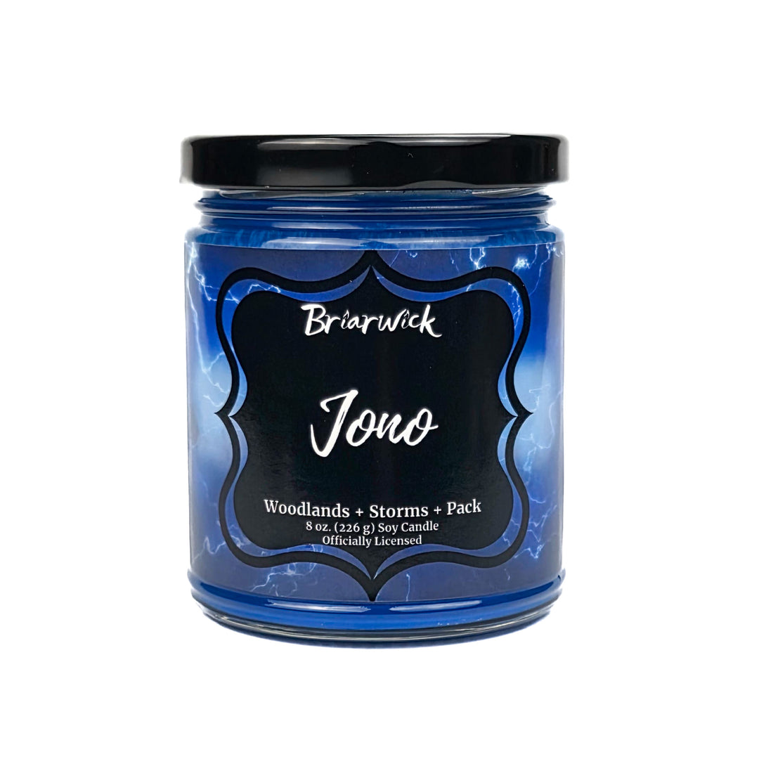 Blue "Jono" candle jar with black lid and label on a white background