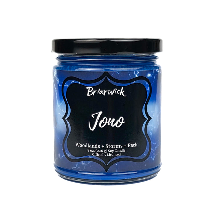 Blue "Jono" candle jar with black lid and label on a white background