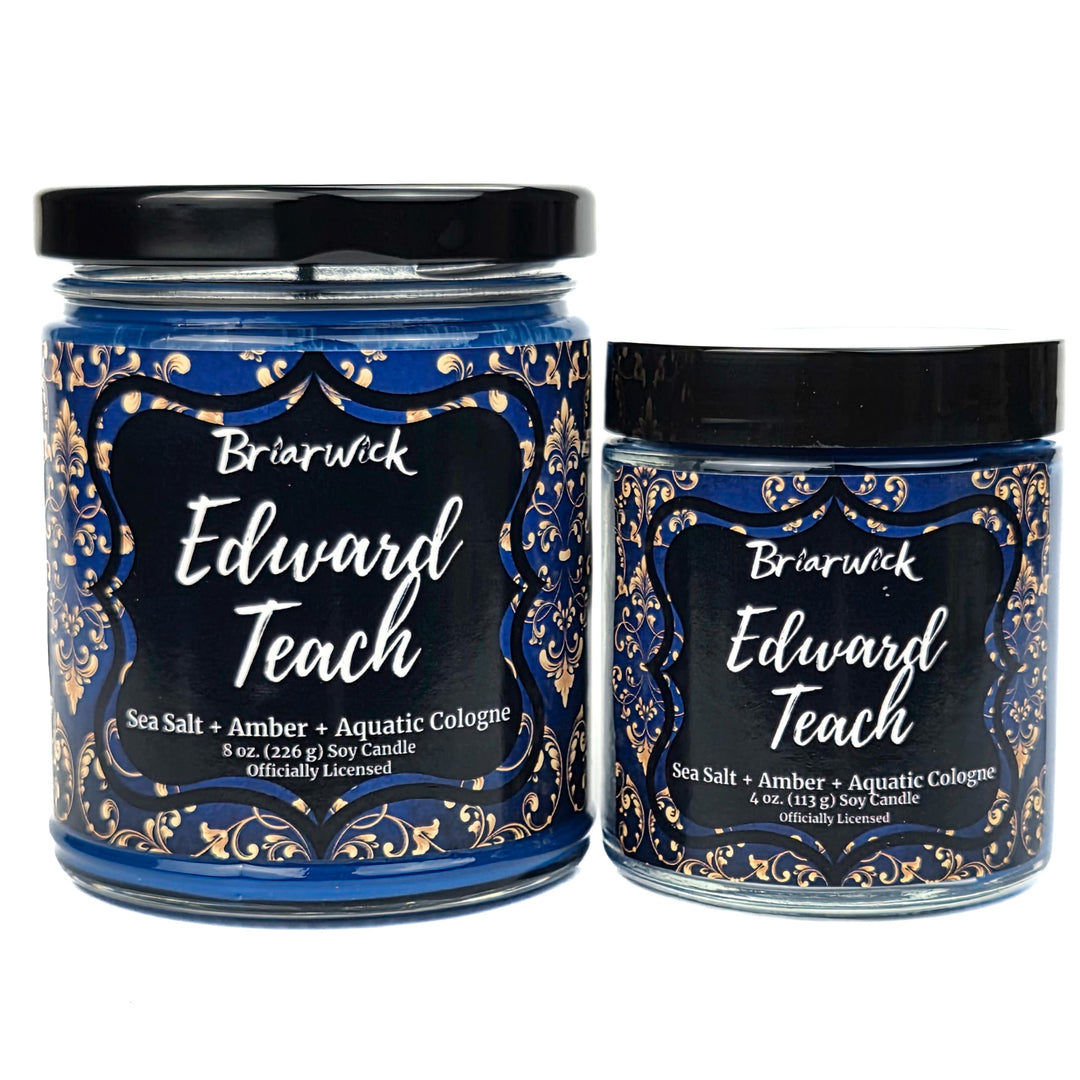 Two candles with decorative labels featuring the name 'Edward Teach' on a white background.