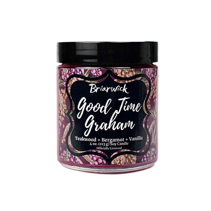 A plum Good Time Graham 4oz candle jar by Briarwick on a white background