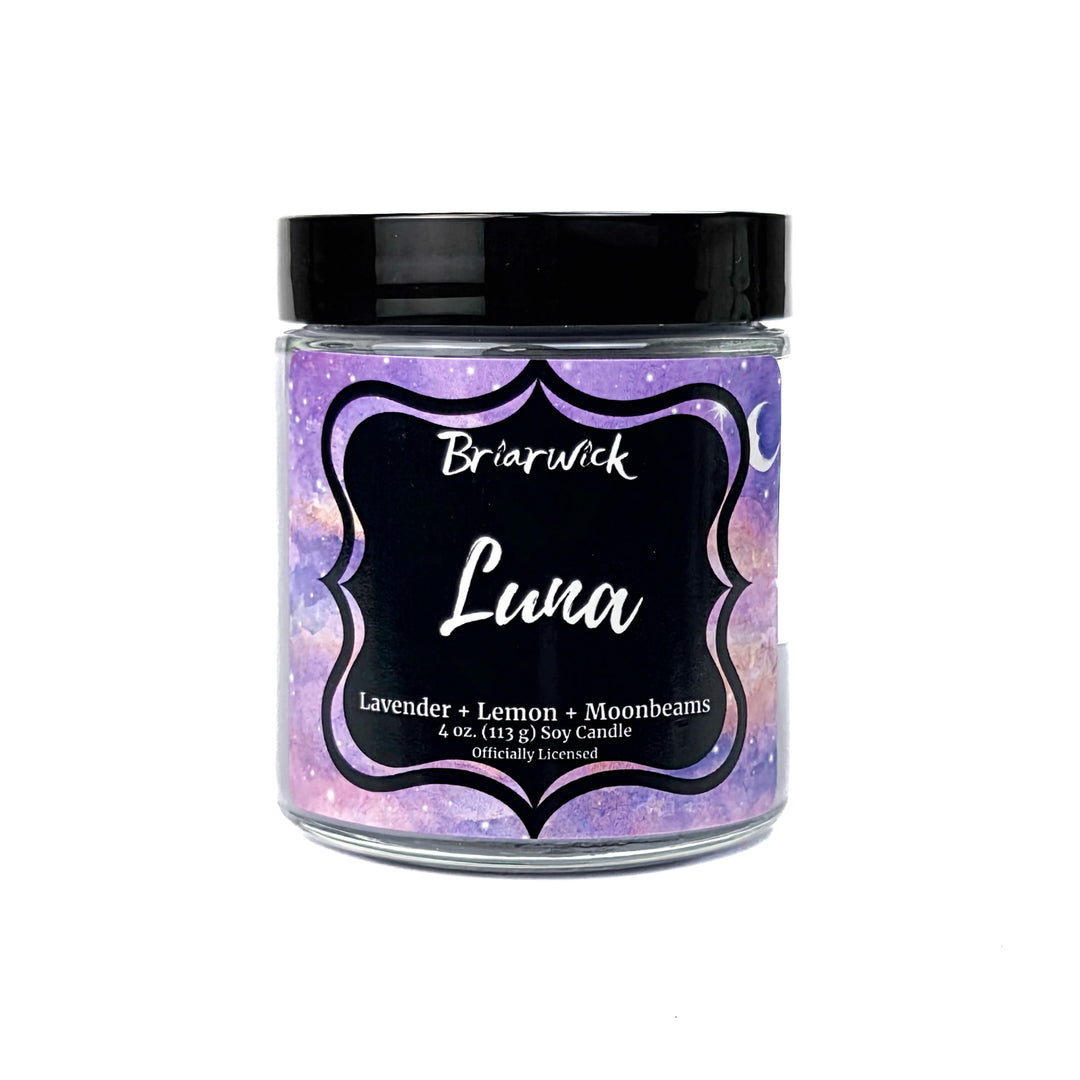 A purple Luna 4oz candle jar by Briarwick on a white background