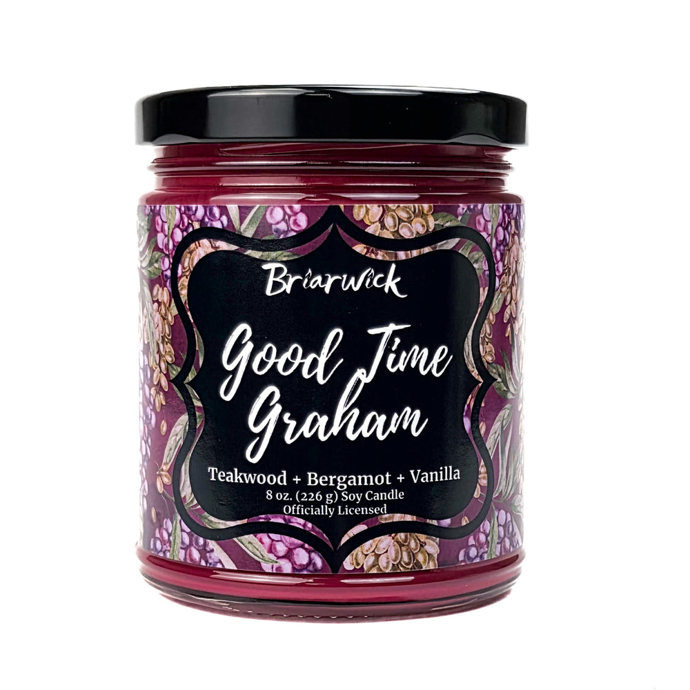 A plum Good Time Graham 8oz candle jar by Briarwick on a white background