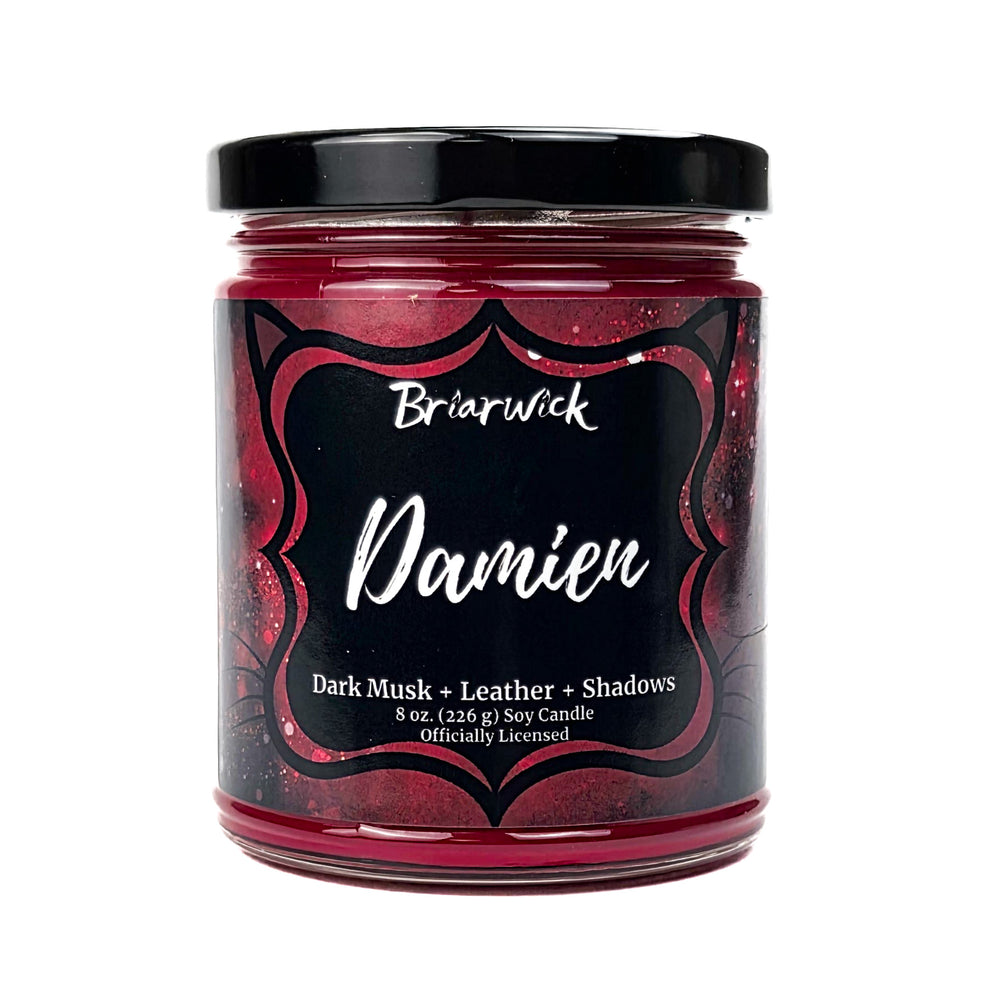 A red Damien 8oz candle jar by Briarwick on a white background
