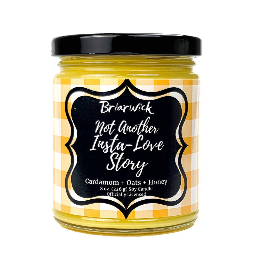 A yellow Not Another Insta Love Story 8 oz candle jar by Briarwick on a white background