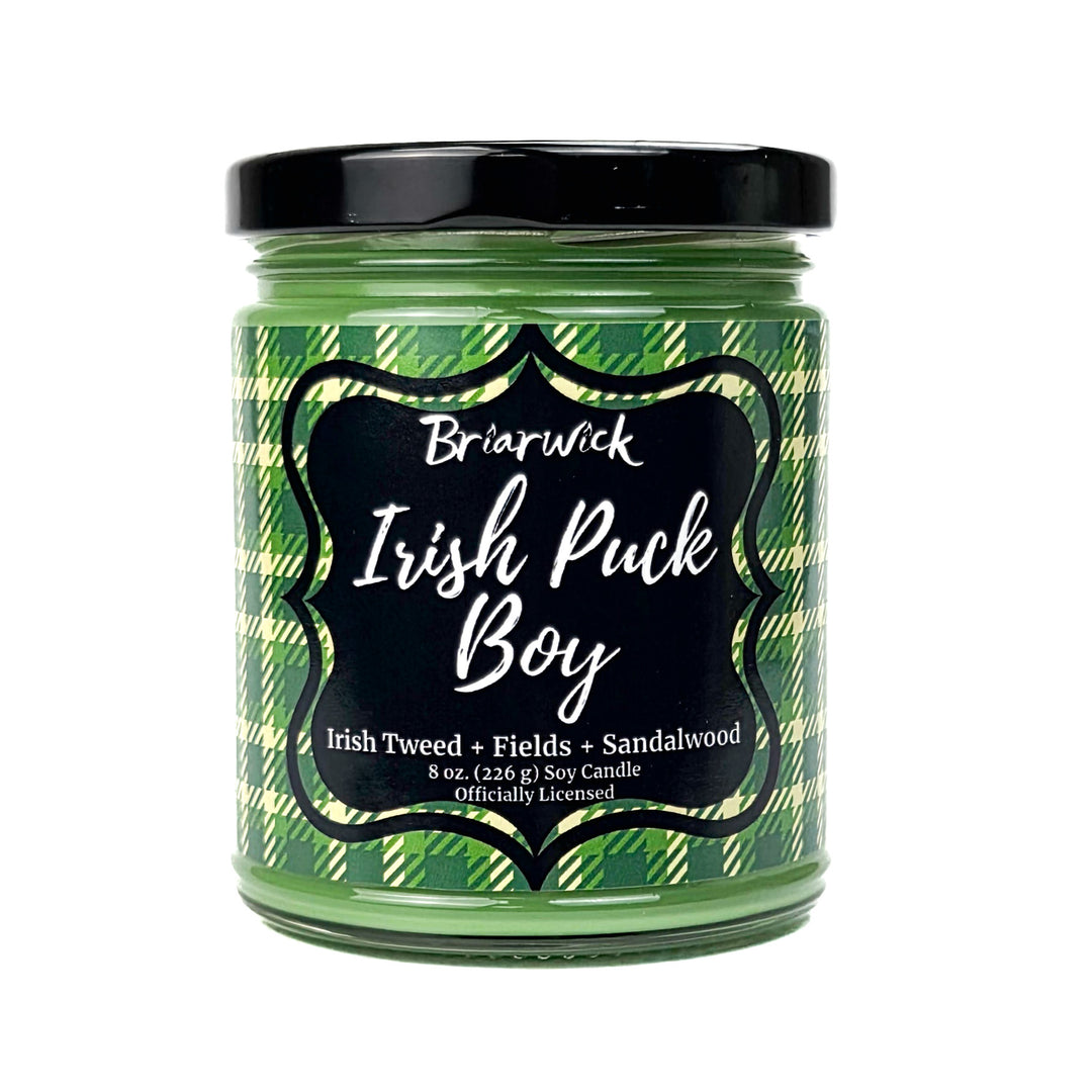 A green Irish Puck Boy 8 oz candle jar by Briarwick on a white background