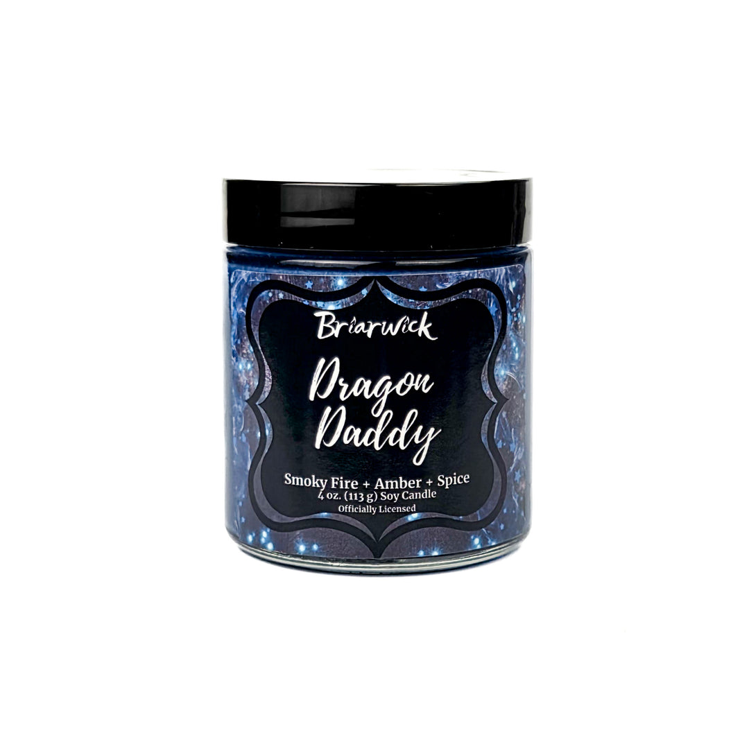 Candle jar labeled 'Dragon Daddy' with a black lid on a white background