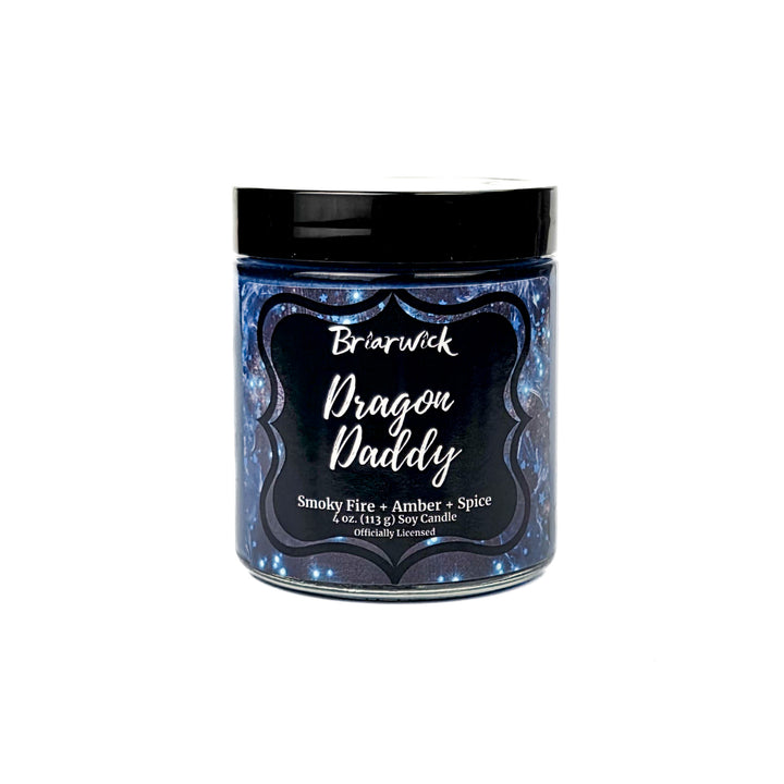 Candle jar labeled 'Dragon Daddy' with a black lid on a white background
