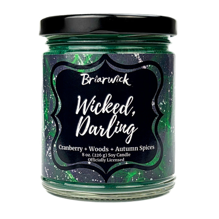 Briarwick 8oz soy candle in glass jar on white background. Green label has scent name Wicked, Darling