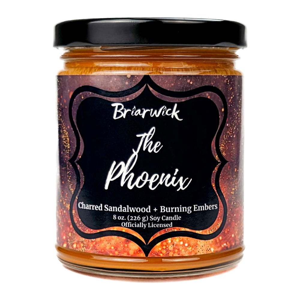 Jar of Briarwick The Phoenix candle with a black lid on a white background