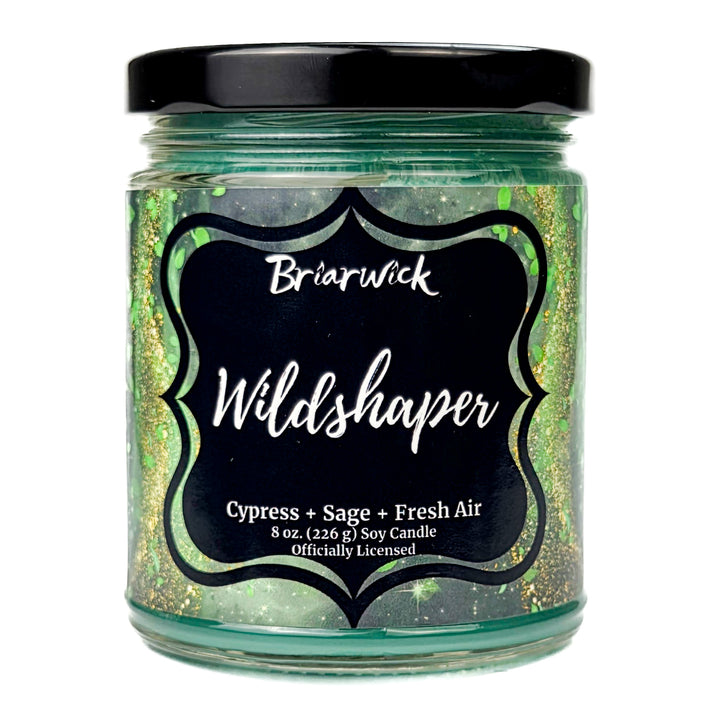 Briarwick 8oz soy candle in glass jar on a white background. Green label has scent name Wildshaper