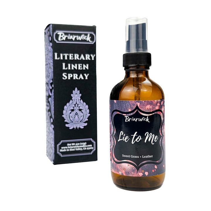 Briarwick Literary Linen Spray bottle and packaging on a white background. Amber bottle has black and red label with scent name Lie to Me