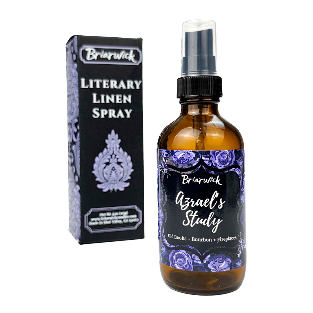 Briarwick Literary Linen Spray bottle and packaging on a white background. Amber bottle has blue rose label with scent name Azrael's Study