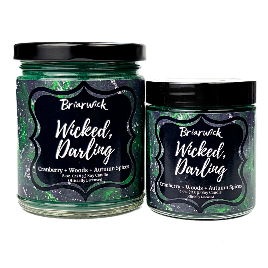 Two green Briarwick Wicked, Darling candles on a white background