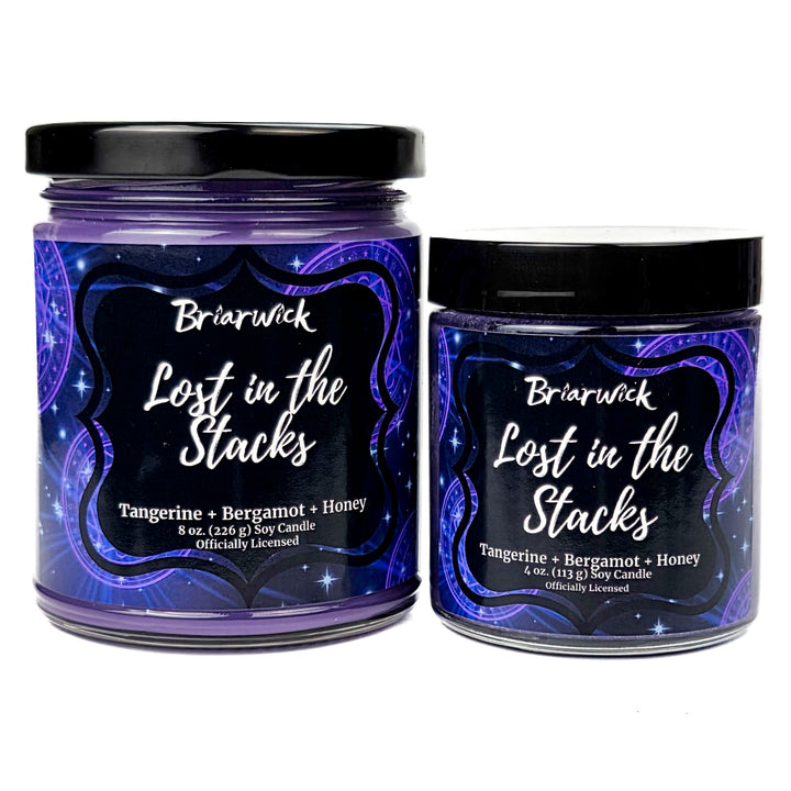 Two Briarwick Lost in the Stacks candles on a white background