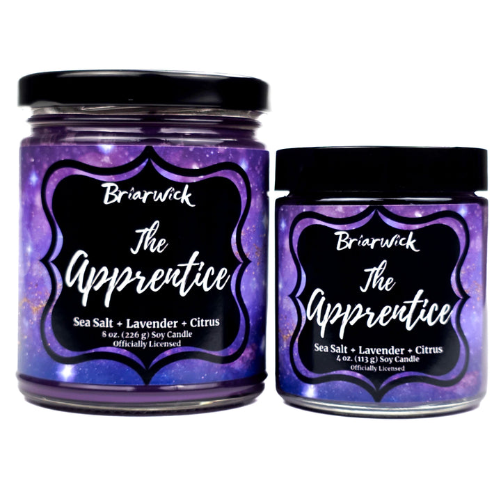Two jars of Briarwick 'The Apprentice' candle with purple labels on a white background
