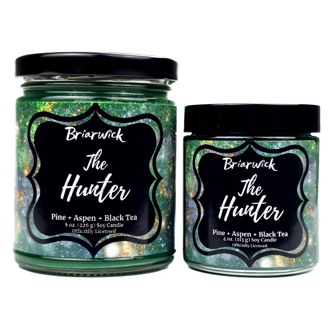 Two Briarwick 'The Hunter' candles with black lids on a white background