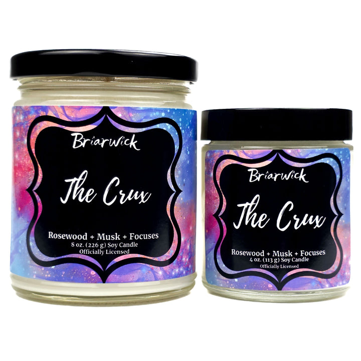 Two jars of Briarwick 'The Crux' candle with colorful labels on a white background
