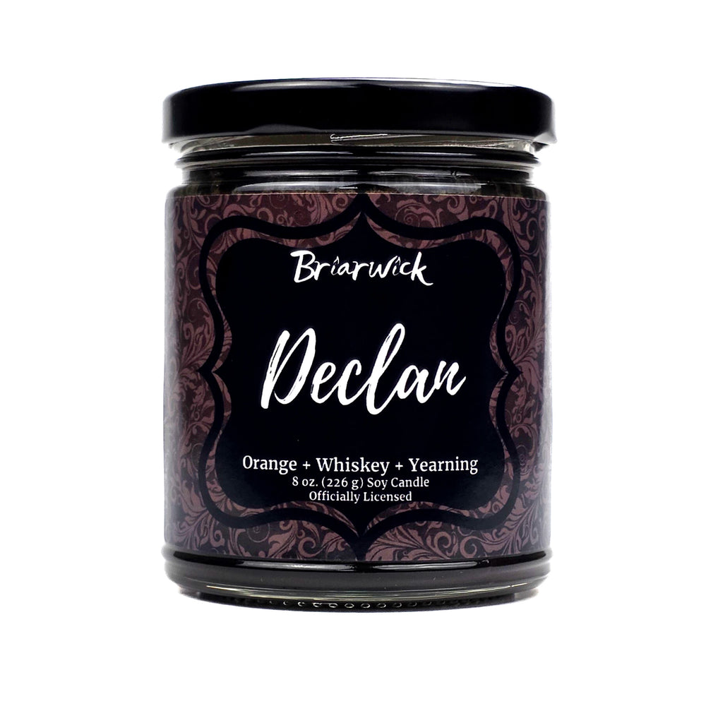 Candle jar with decorative label on a white background