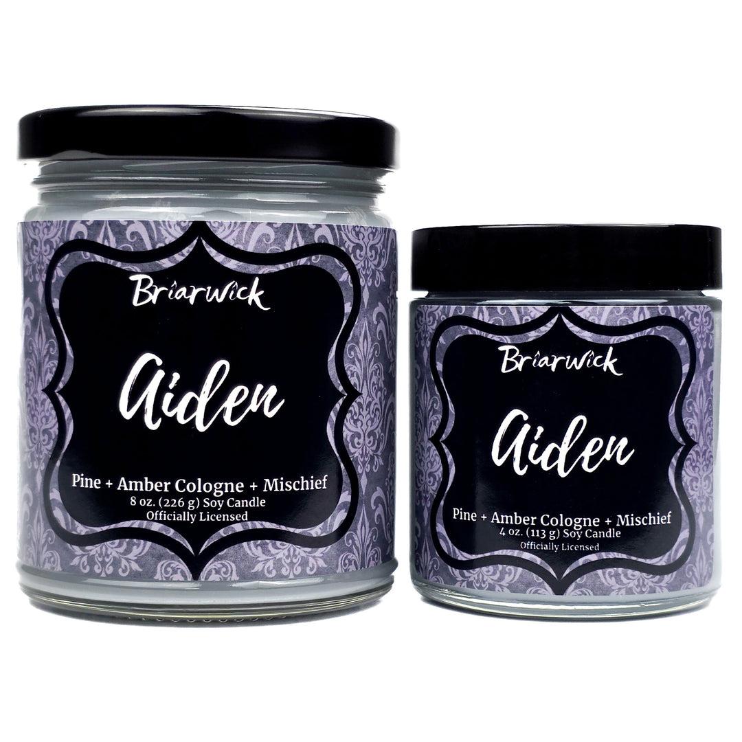 Two Briarwick Aiden candles with decorative labels on a white background