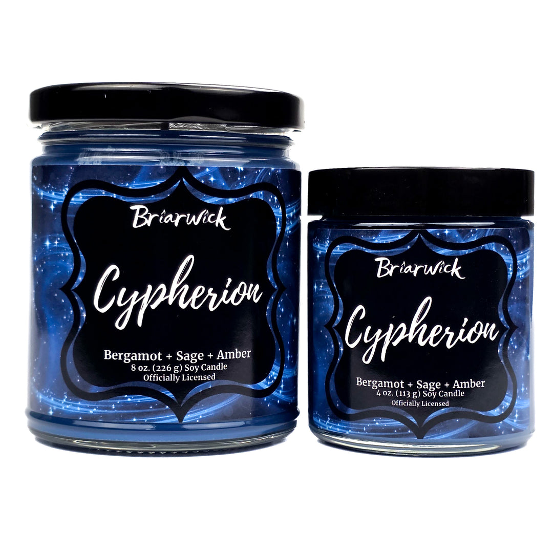 Two Briarwick Cypherion candles with blue glittery labels on a white background