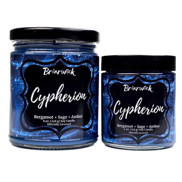 Two Briarwick Cypherion candles with blue glittery labels on a white background