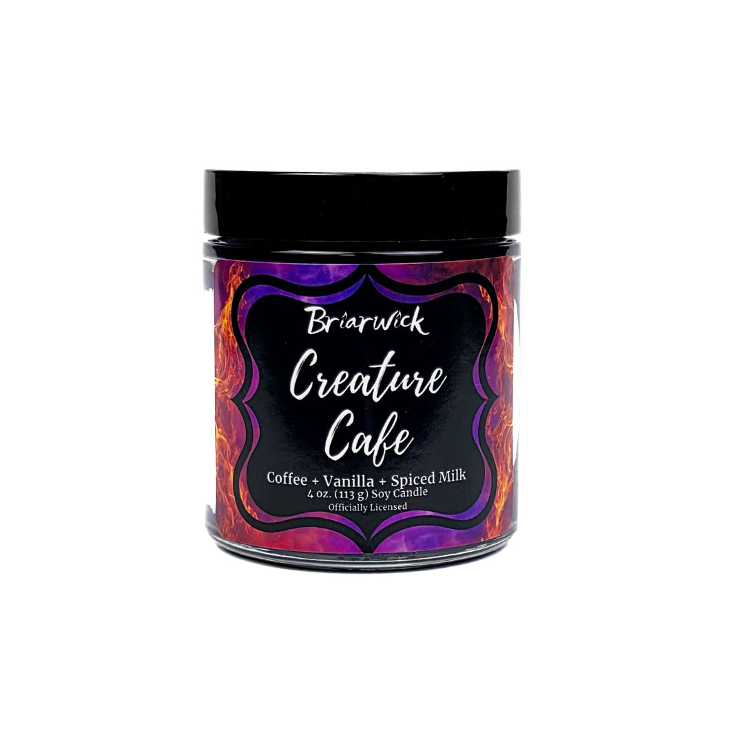 Jar of Briarwick Creature Cafe candle with colorful label on a white background