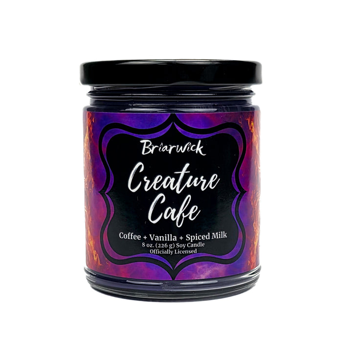 Candle jar with 'Briarwick Creature Cafe' label on a white background