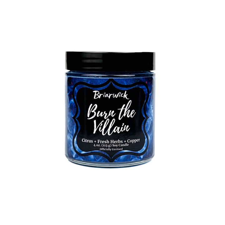 Jar of candle labeled 'Burn the Villain' by Briarwick on a white background