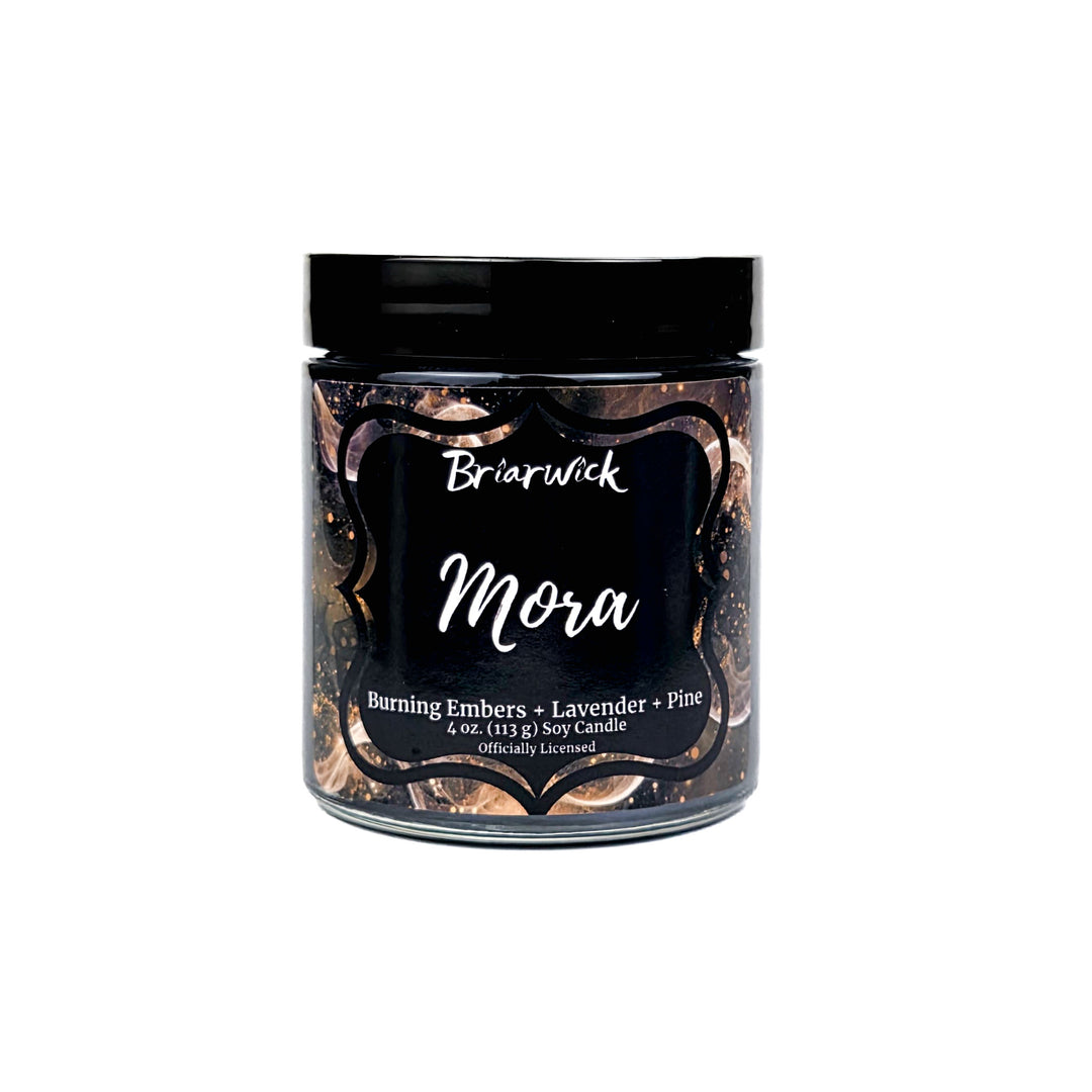 Jar of Briarwick Mora candle with decorative label on a white background