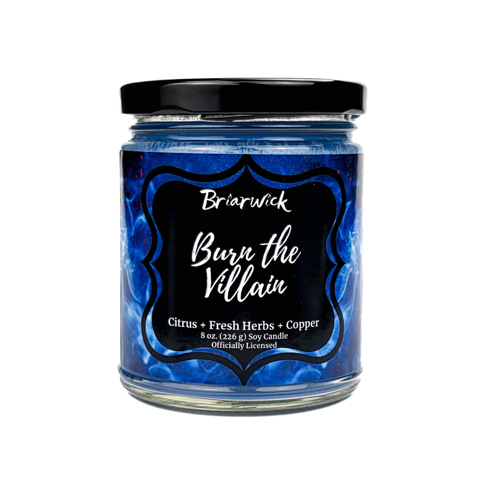 Jar of "Burn the Villain" candle with 'Briarwick' branding on a white background